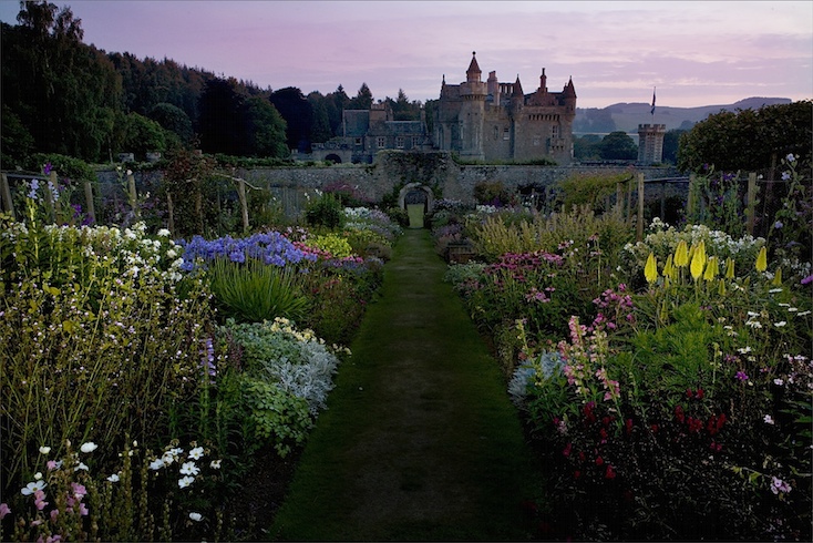 Twilight at Abbotsford - herbaceous borders illuminated by torchlight Twilight at Abbotsford - herbaceous borders illuminated by torchlight